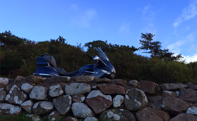 BMW K1200LT motorcycle photo taken next to  a stone walls at Kullen outisde Helsingborg.